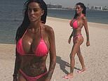 Katie Price flaunts her assets in a hot pink bikini on the beach in Dubai just one day after British Airways cancelled flights there amid Middle East strikes