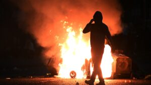 Yobs hurl petrol bombs, fireworks and bottles at cops in FIFTH night of riots as chaos spreads to new town
