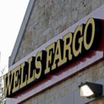 China imposes exit bans on Wells Fargo banker, U.S. government worker