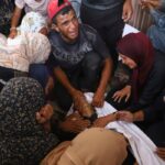 At least 51 Palestinians killed while waiting for aid trucks in Gaza, health officials say