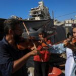 Gaza’s young musicians sing and play in the ruins of war
