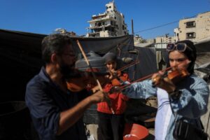 Gaza’s young musicians sing and play in the ruins of war