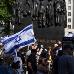 Iranian dissident journalist choked in assault at London march for release of hostages