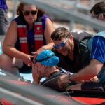 Top triathlete called an ‘absolute warrior’ after moving dislocated shoulder back DURING swim
