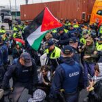Garda public order unit physically remove Gaza protesters blocking Dublin Port amid major traffic disruption