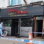 Boy, 15, and man arrested after fire attack on Indian restaurant in east London