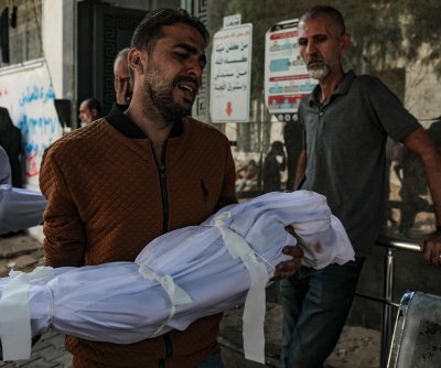 Gaza: Israeli strikes kill at least 100, including dozens of children