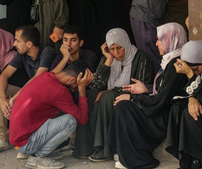 Israel fires on family crossing cease-fire line in bus, killing 11