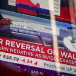 Global stocks slip after sharp reversal on Wall Street