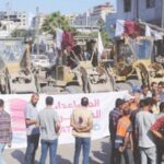 Israel cuts agreed aid flow over ‘slow release’ of bodies