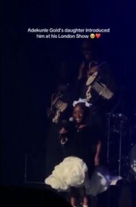 Nigerian Singer, Adekunle Gold’s Daughter Melts Hearts As She Introduces Dad On Stage In London (Video)