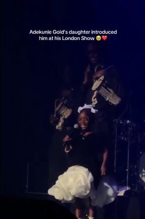 Nigerian Singer, Adekunle Gold’s Daughter Melts Hearts As She Introduces Dad On Stage In London (Video)