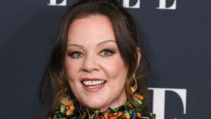Melissa McCarthy looks sleek after weight loss in two sparkly outfits -through black ensemble
