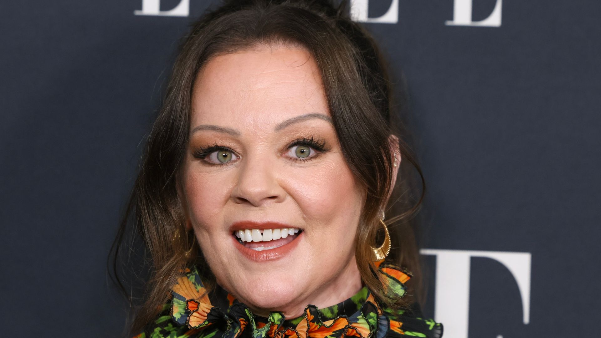 Melissa McCarthy looks sleek after weight loss in two sparkly outfits -through black ensemble