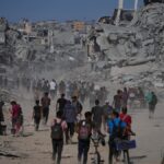 Thousands of Palestinians return to what’s left of their homes as Gaza ceasefire takes effect