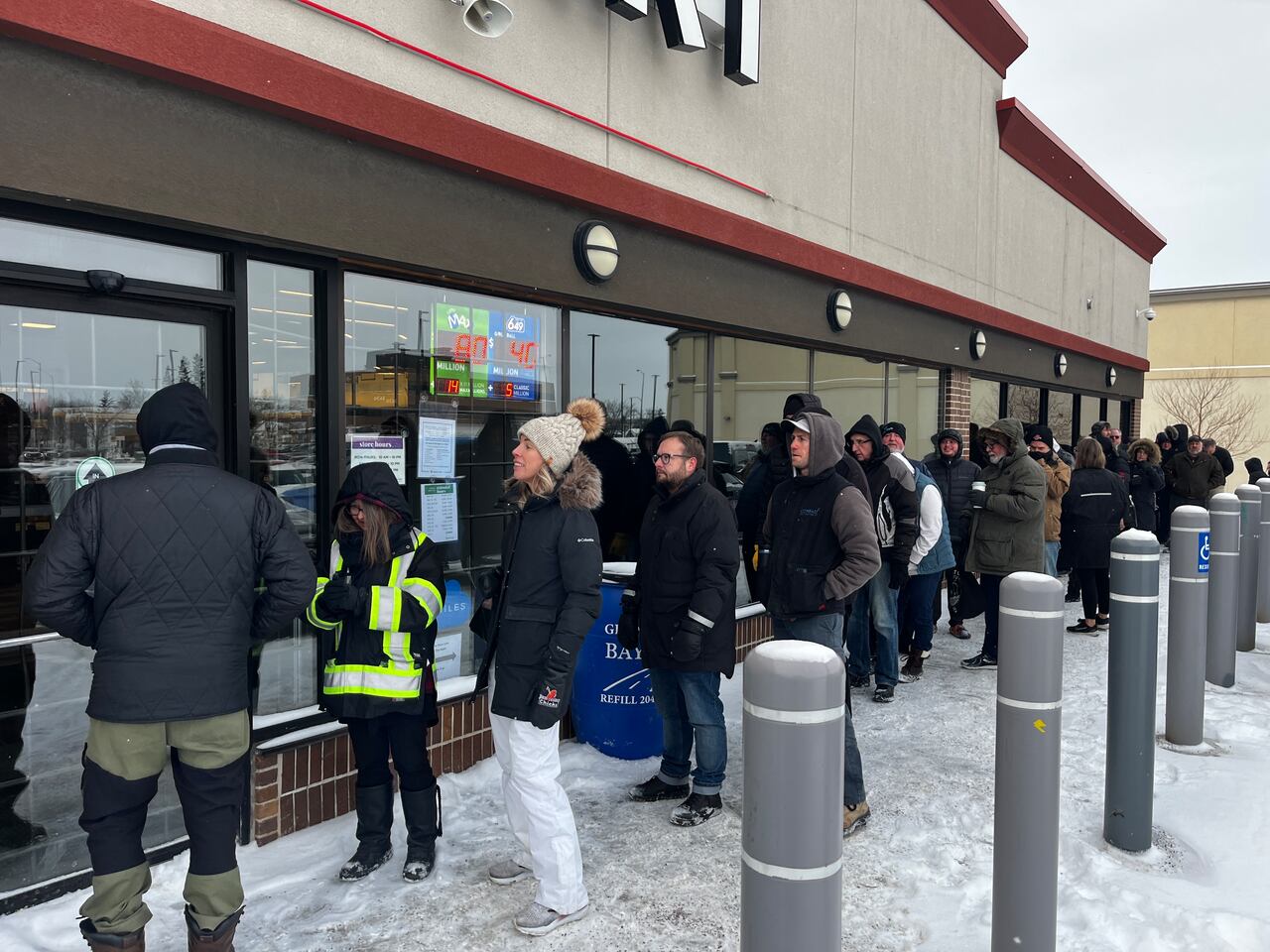 Customers line up at Manitoba Liquor Marts for 1st chance to buy American liquor in months