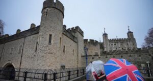 Four Arrested After Throwing Apple Crumble And Custard At Crown Display In London