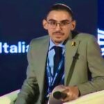 Ex-hostage Rom Braslavski recounts ‘horrors’ of Oct. 7 at Italy’s ruling party conference