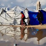 ‘Shivering from cold and fear’: winter rains batter displaced Gazans