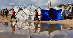 ‘Shivering from cold and fear’: winter rains batter displaced Gazans