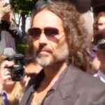 Russell Brand charged with third count of rape by London police
