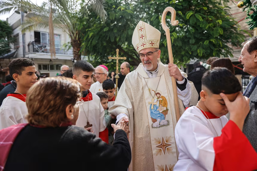 ‘We are still here.’ Catholic patriarch leads Christmas Mass at Gaza church bombed by Israel during the war