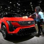 At Detroit auto show, spotlight dims for EVs
