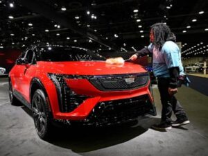 At Detroit auto show, spotlight dims for EVs