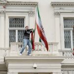 Dramatic scenes as man climbs Iranian embassy balcony in central London as two people arrested