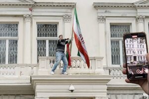 Dramatic scenes as man climbs Iranian embassy balcony in central London as two people arrested
