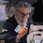 US futures slip while Asian shares surge as Fed chair Powell faces legal threat