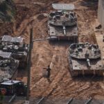 U.S. sinks Iranian warship as Iran warns of widespread destruction in the Middle East