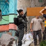 Eight Israelis held after assault on Palestinian village