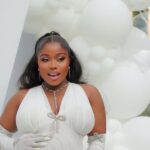 Veekee James’s White Maternity Gown Featured Opera Gloves and Crystal Details