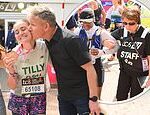 Gordon Ramsay gives his daughter Tilly a congratulatory kiss on the cheek while Cynthia Erivo is helped by a member of staff as they lead stars finishing the London marathon