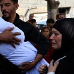Palestinians bury pregnant woman and 2 of her children killed in Israeli attacks on Gaza