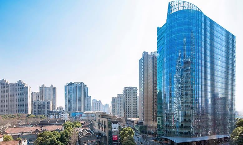 CalPERS-Backed Fund Sells Office Tower Near Shanghai’s Xintiandi at 43% Off