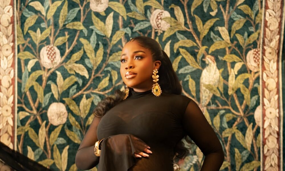 Veekee James Shows Off Her Baby Bump in a Gorgeous Sheer Black Dress | See Photos