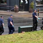 Man in life-threatening condition among four injured after gunshots fired from vehicle