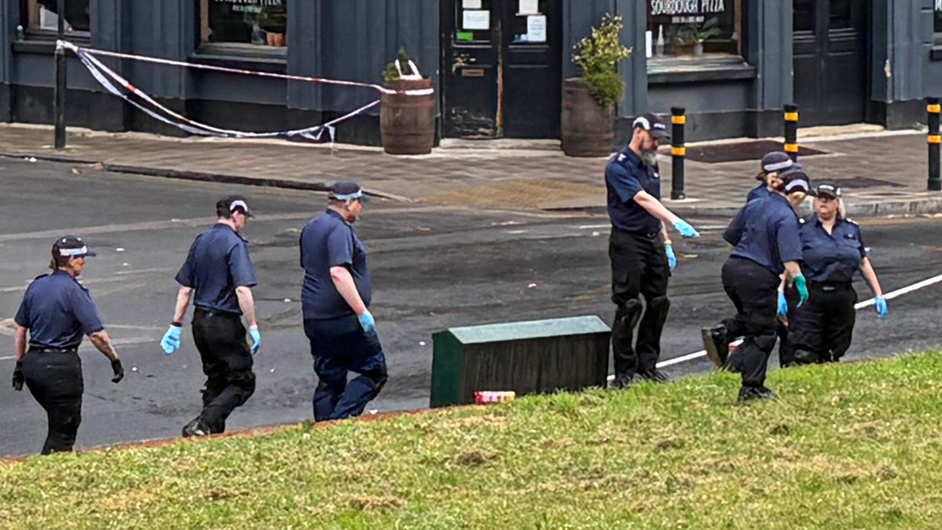 Man in life-threatening condition among four injured after gunshots fired from vehicle