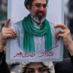 US bombs military sites on Iranian island as Trump threatens its oil infrastructure