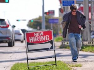US filings for jobless aid tick up last week to 210,000 but remain at healthy levels