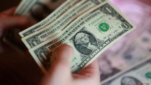 Dollar climbs for fifth straight day as Fed rate hike bets grow