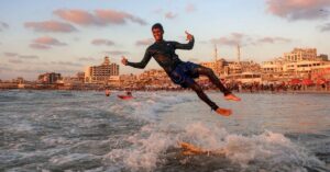 Gaza’s surfers seek solace in the sea