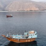 Iranian drones attack Bahrain and a ship is struck in the strait after U.S. airstrikes